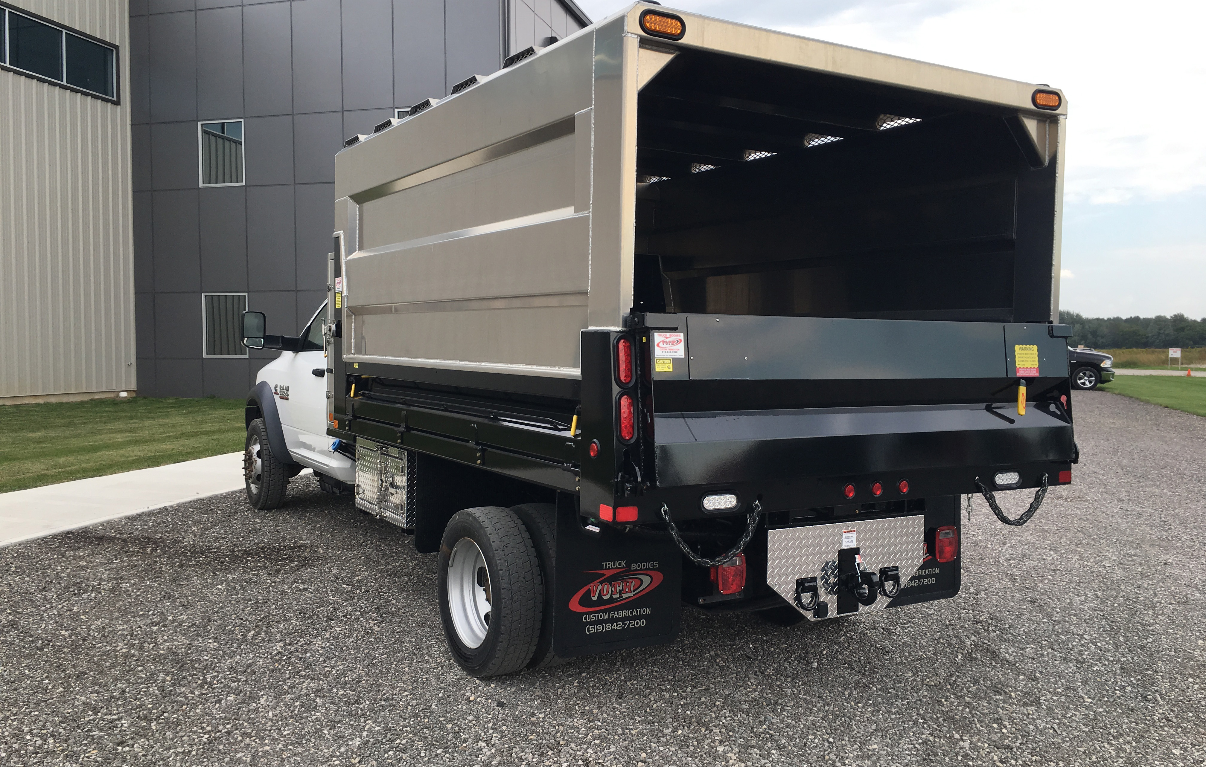 rear view of steel voth unibody dump with aluminum chipper hood